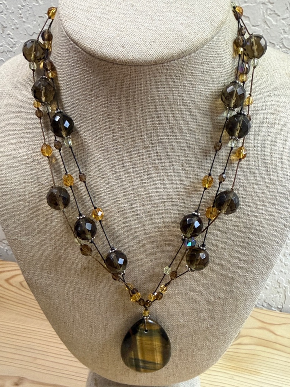 Layered Amber-Tone Beaded Necklace with Striped Teardrop Pendant